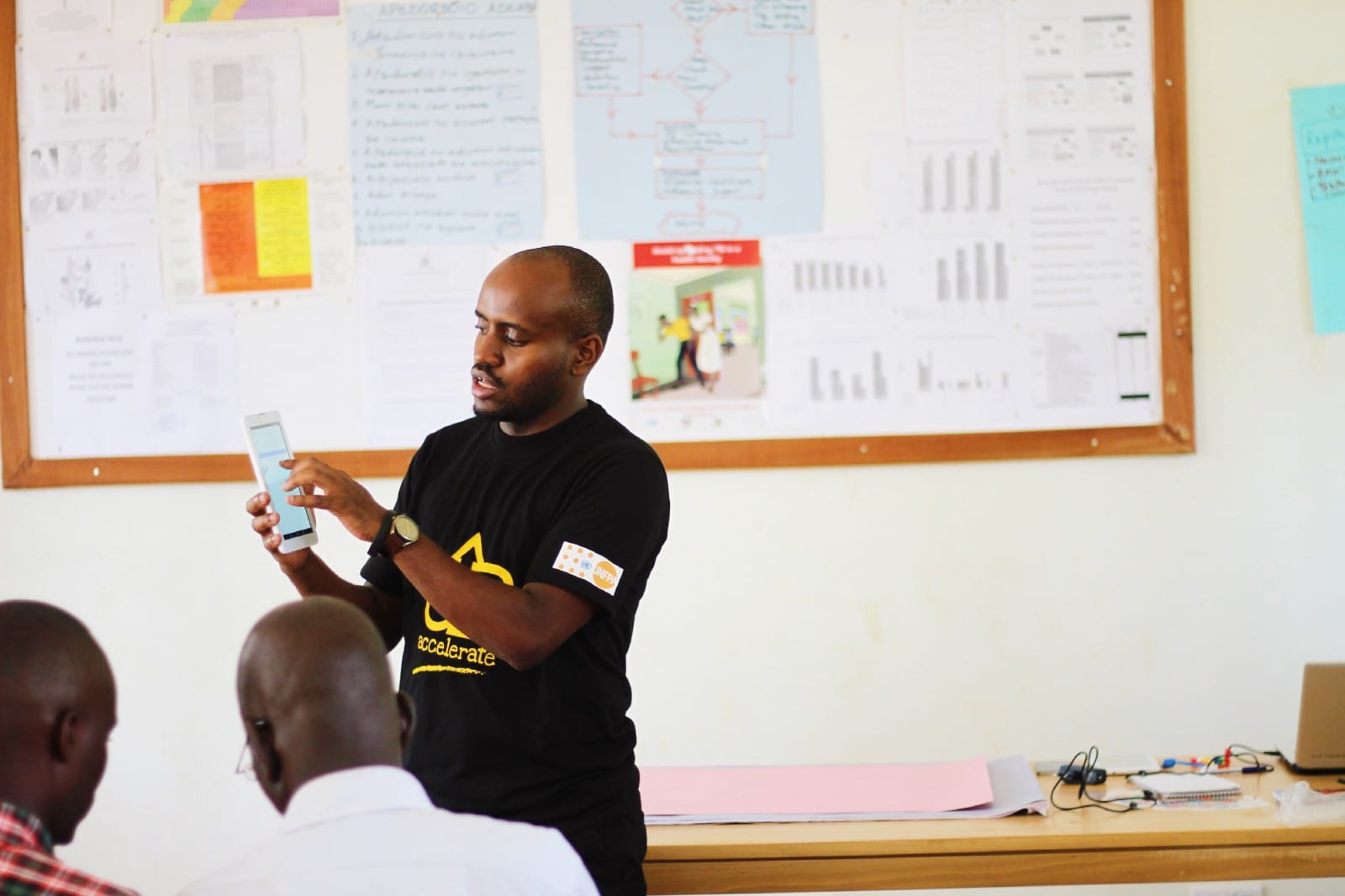 Solomon Kahuma conducting a training for health workers in Bukedea District on how to use DrugDash