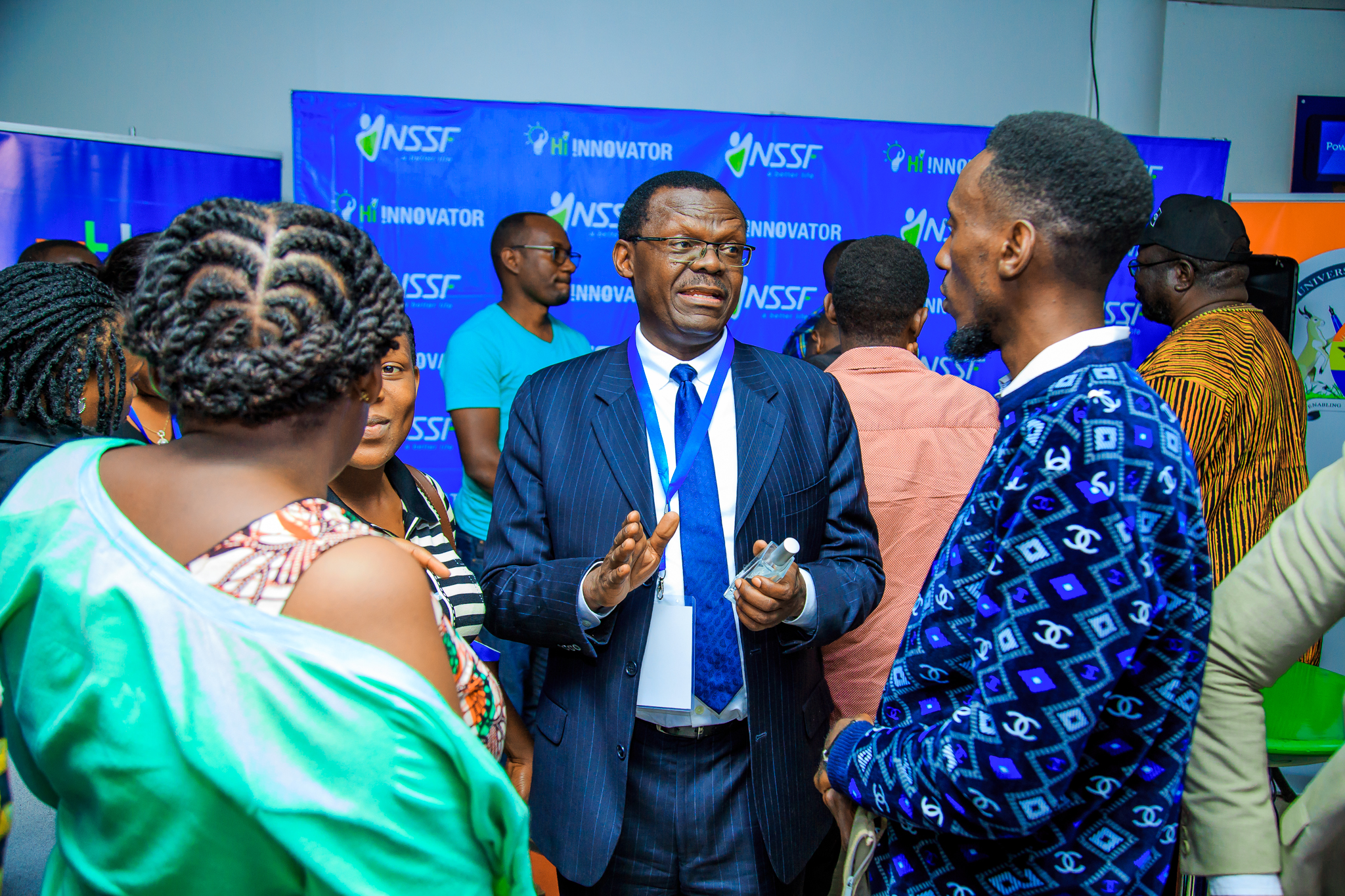 NSSF Deputy Managing Director, Patrick Ayota, speaking to some of the small business owners during an information session on the programme held at Outbox.